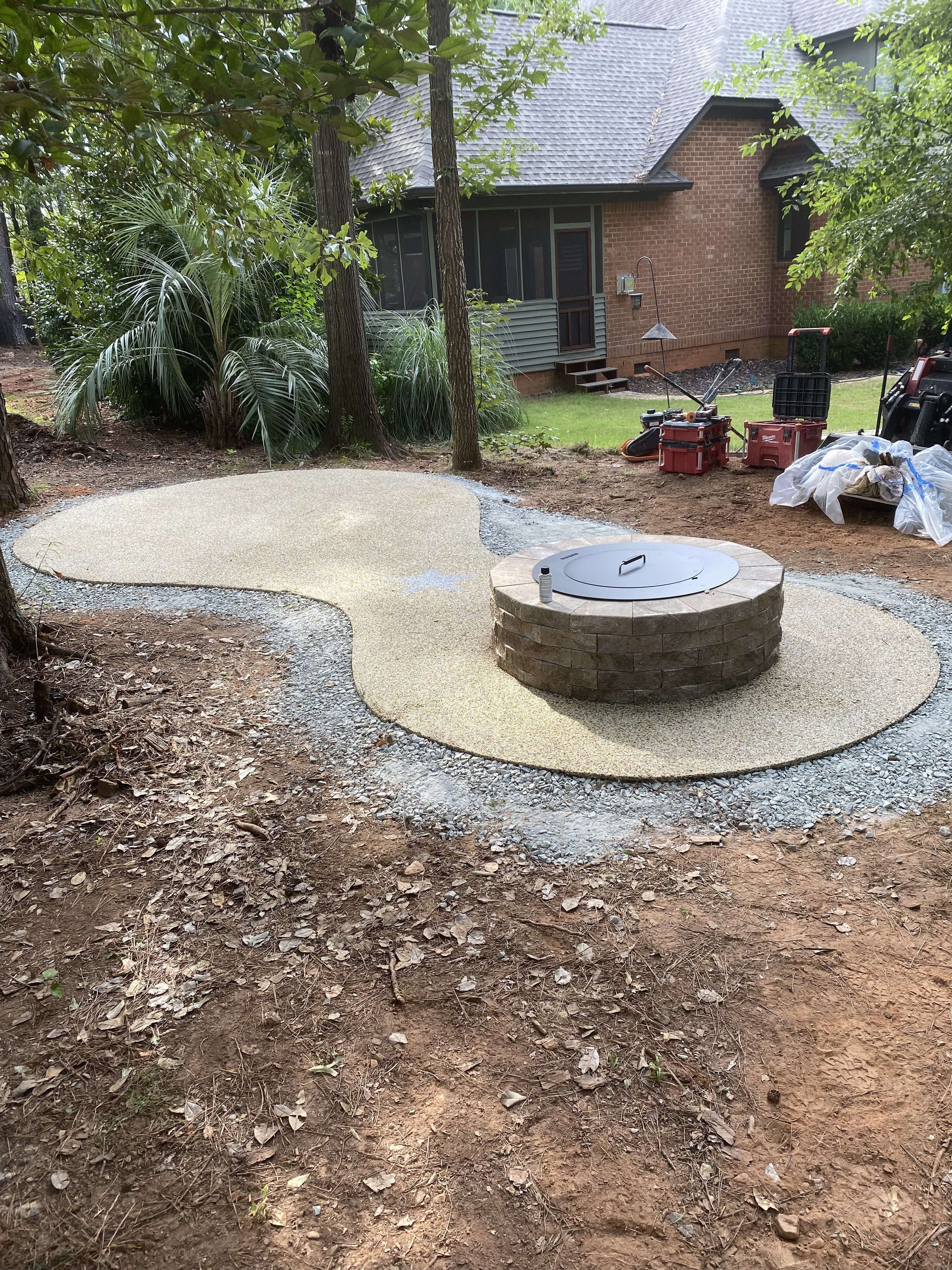 Resin bound stone patio with decorative fire pit feature